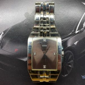 Guess silver watch with taupe face.